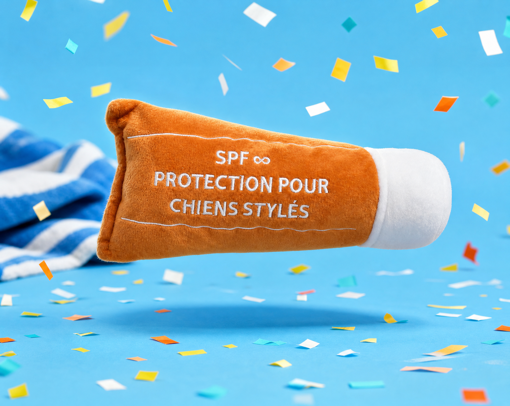 Jouet crème solaire French Bandit en lévitation sur fond bleu avec confettis